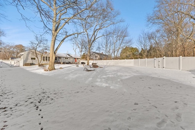 view of yard layered in snow