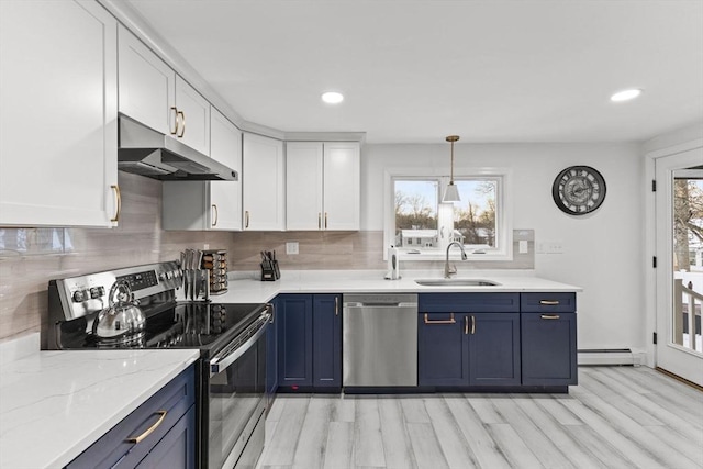 kitchen featuring sink, appliances with stainless steel finishes, hanging light fixtures, white cabinets, and blue cabinets