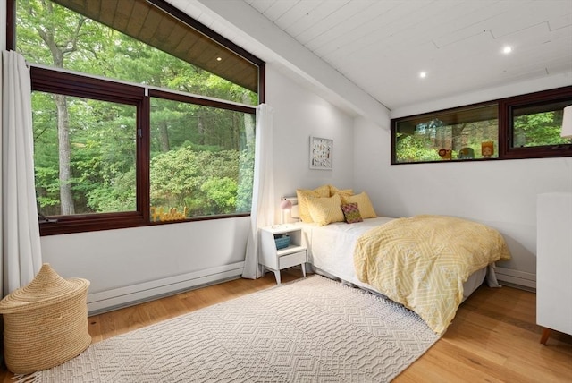 86 Myles Standish Rd, Weston, MA 02493 - bedroom featuring wood finished floors, baseboard heating, lofted ceiling, baseboards, and recessed lighting