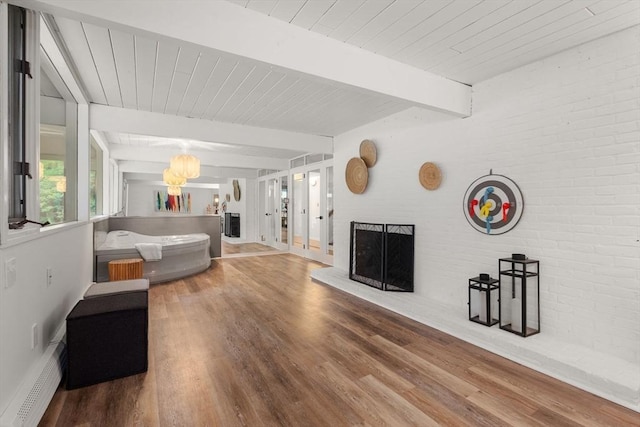 86 Myles Standish Rd, Weston, MA 02493 - bedroom featuring baseboard heating, wood finished floors, a fireplace, wooden ceiling with exposed beams, and baseboards