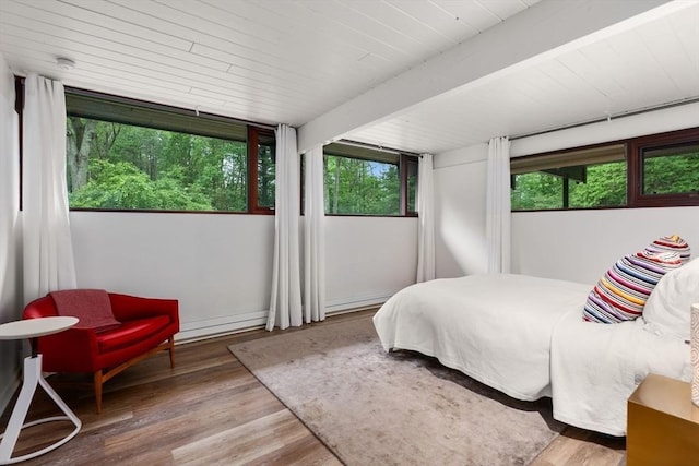86 Myles Standish Rd, Weston, MA 02493 - bedroom featuring wood finished floors, multiple windows, and wooden ceiling