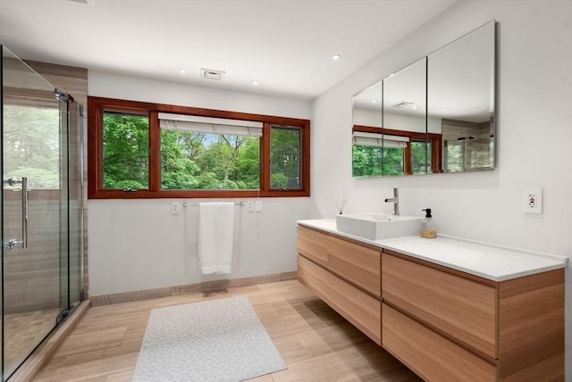 86 Myles Standish Rd, Weston, MA 02493 - full bath featuring vanity, a shower stall, wood finished floors, recessed lighting, and baseboards