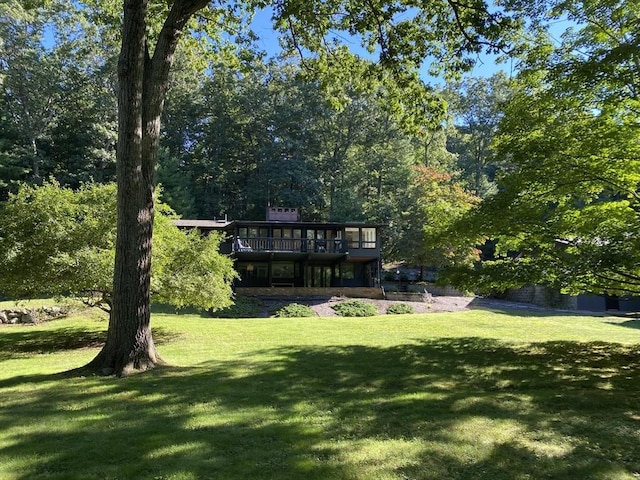 86 Myles Standish Rd, Weston, MA 02493 - view of grassy yard featuring a deck