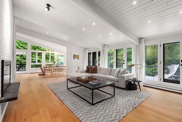 86 Myles Standish Rd, Weston, MA 02493 - living area with healthy amount of natural light, light wood-style floors, baseboard heating, and wood ceiling