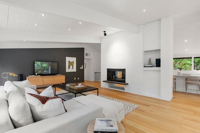 86 Myles Standish Rd, Weston, MA 02493 - living room with wood finished floors, a multi sided fireplace, and recessed lighting