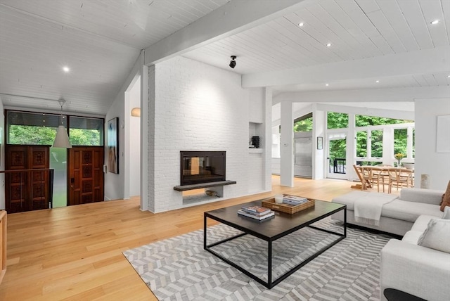 86 Myles Standish Rd, Weston, MA 02493 - living room featuring wood finished floors, healthy amount of natural light, a brick fireplace, and wooden ceiling