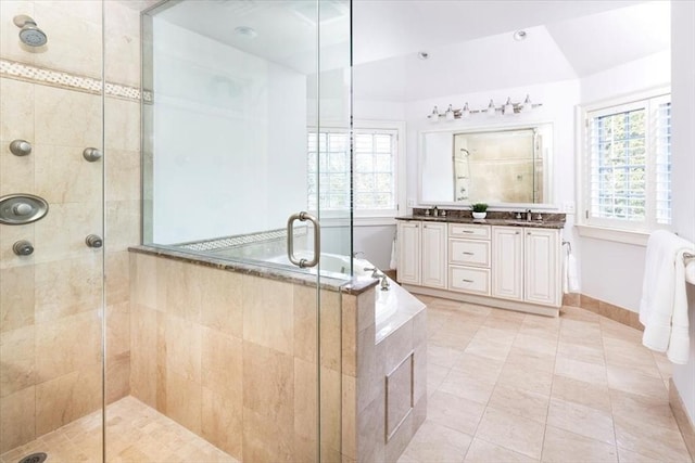 bathroom featuring tile patterned floors, separate shower and tub, and vanity