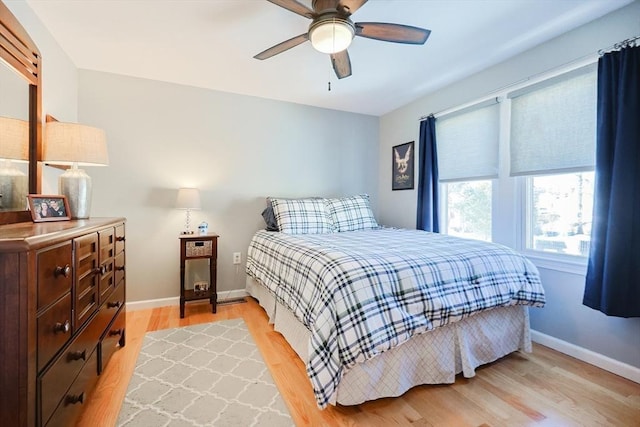 bedroom featuring light hardwood / wood-style floors and ceiling fan