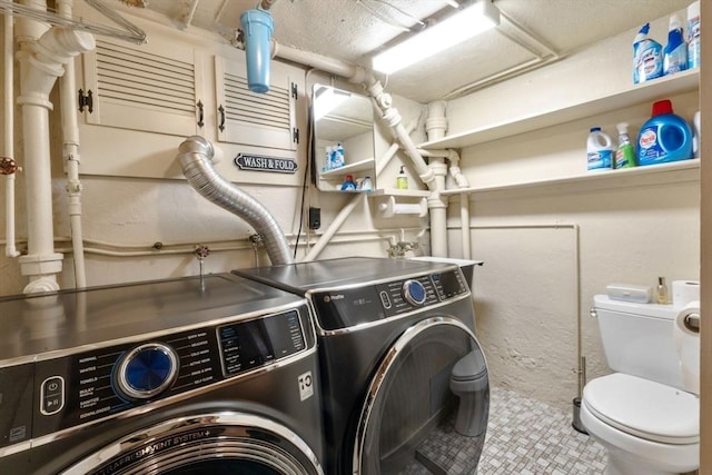 laundry room with washer and dryer