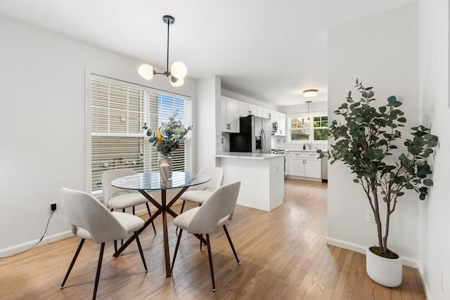 32 Pearl St Unit 32, Everett, MA 02149 - dining space with light wood-type flooring and a chandelier