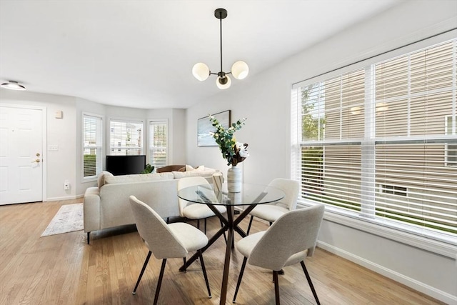 32 Pearl St Unit 32, Everett, MA 02149 - dining room featuring light wood-type flooring and a chandelier
