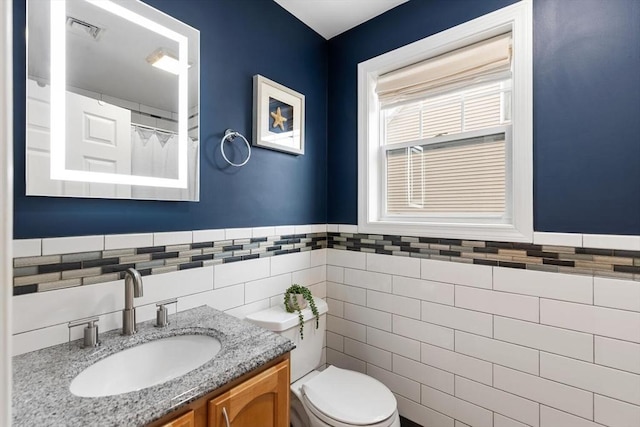 32 Pearl St Unit 32, Everett, MA 02149 - full bathroom with tile walls, vanity, wainscoting, and a shower with curtain