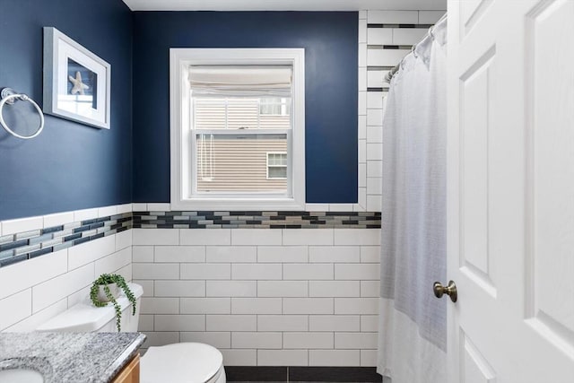 32 Pearl St Unit 32, Everett, MA 02149 - full bath featuring tile walls, vanity, wainscoting, and a shower with curtain