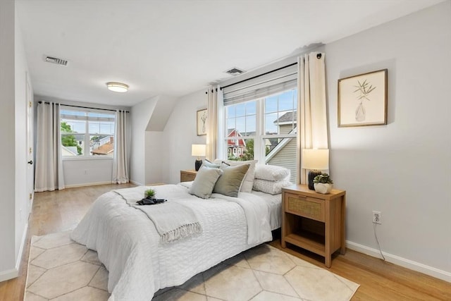 32 Pearl St Unit 32, Everett, MA 02149 - bedroom featuring multiple windows and light wood-type flooring