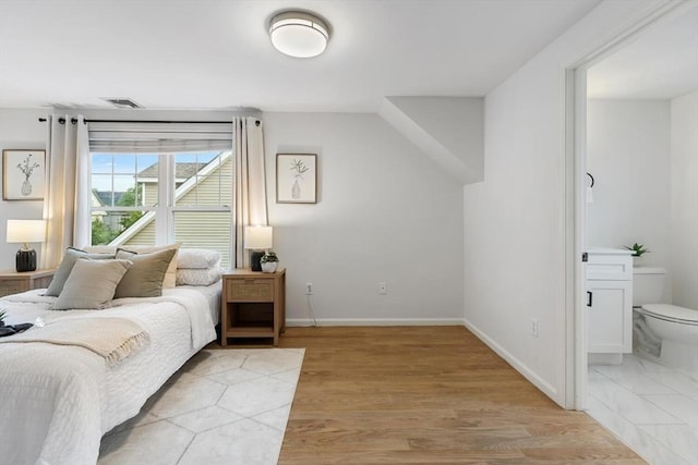 32 Pearl St Unit 32, Everett, MA 02149 - bedroom with light wood finished floors and connected bathroom