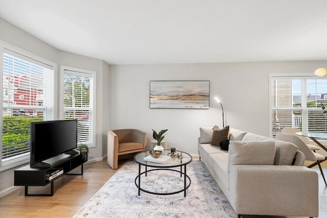 32 Pearl St Unit 32, Everett, MA 02149 - living area featuring plenty of natural light and light wood finished floors