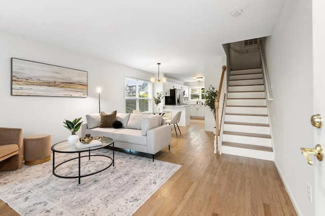 32 Pearl St Unit 32, Everett, MA 02149 - living area featuring light wood-style floors and stairs