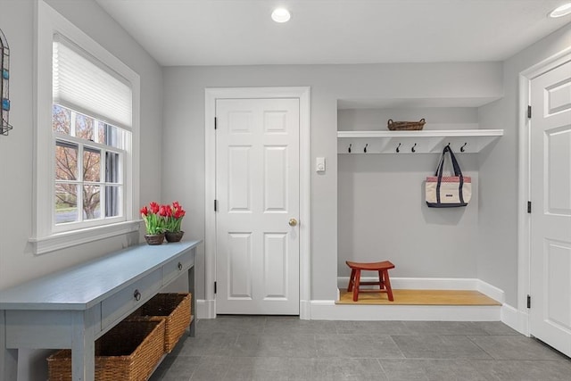 mudroom with baseboards and recessed lighting