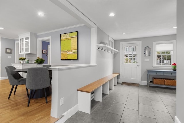 mudroom featuring recessed lighting, ornamental molding, and baseboards