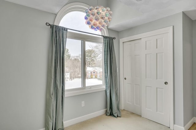 bedroom featuring light colored carpet and a closet