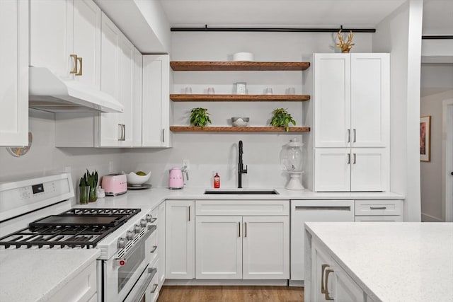 kitchen featuring dishwasher, sink, white cabinets, white gas range oven, and light stone countertops