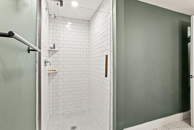 bathroom with a tile shower