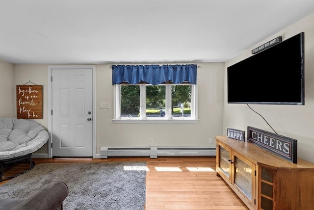 12 Day St, Fairhaven, MA 02719 - living room with a baseboard heating unit and wood finished floors