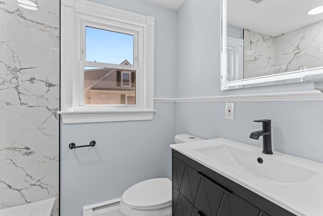 bathroom with a marble finish shower, vanity, and toilet