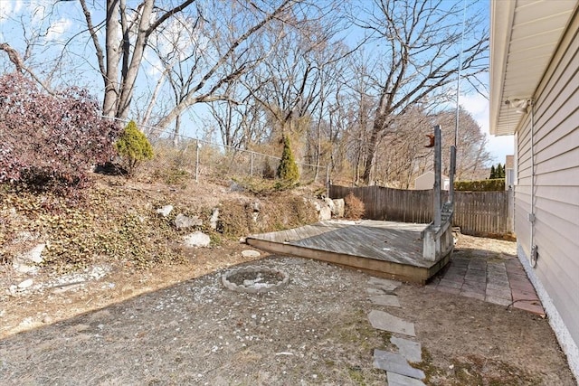 view of yard with fence and a wooden deck