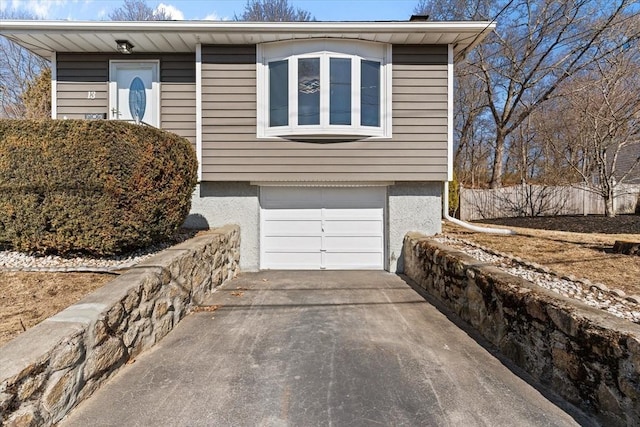 view of front of property with driveway and an attached garage