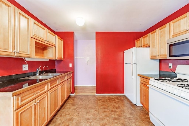 kitchen with sink and white appliances