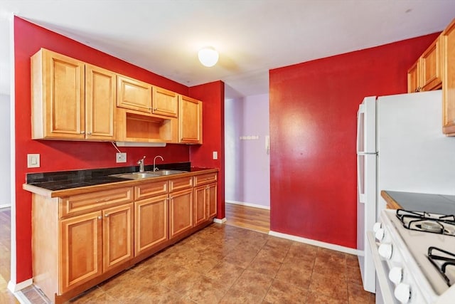 kitchen with sink and white gas range