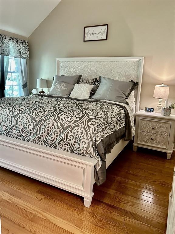 882 Brockton Ave Unit 10, Abington, MA 02351 - bedroom with lofted ceiling and wood finished floors