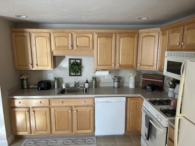 882 Brockton Ave Unit 10, Abington, MA 02351 - kitchen with white appliances, a sink, light countertops, light tile patterned flooring, and recessed lighting