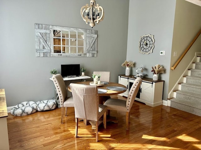 882 Brockton Ave Unit 10, Abington, MA 02351 - dining room with a chandelier, wood finished floors, stairway, and baseboards