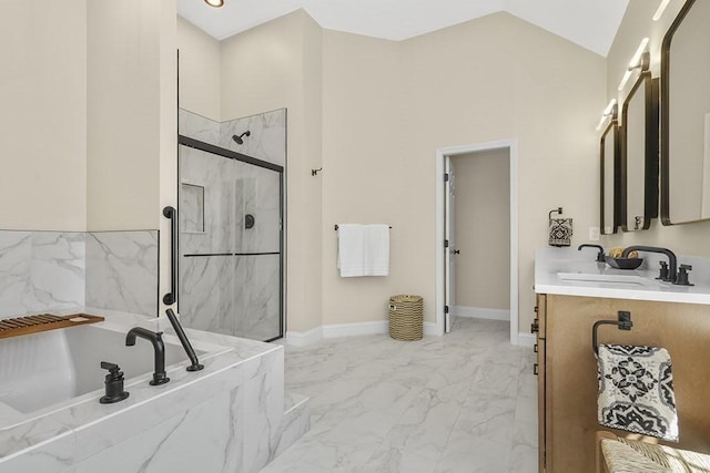 full bathroom with vanity, marble finish floor, lofted ceiling, a bath, and a marble finish shower