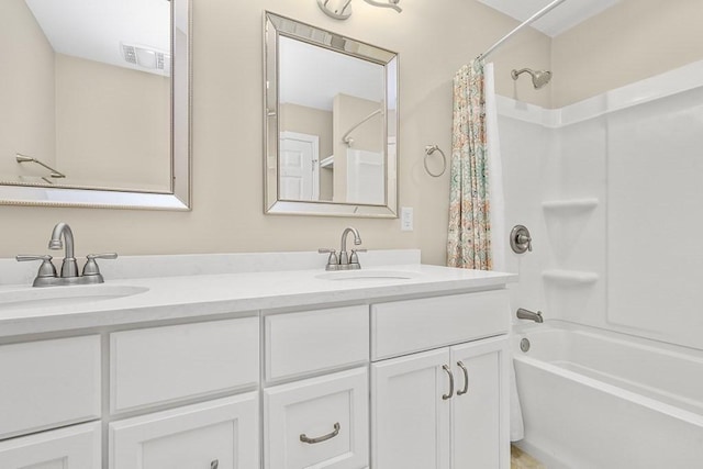 full bath with visible vents, a sink, shower / bath combination with curtain, and double vanity