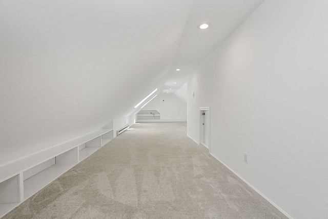 additional living space with recessed lighting, carpet, a baseboard heating unit, and vaulted ceiling