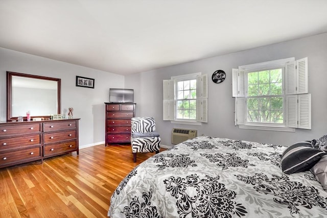 50 Lake St Unit B, Winchester, MA 01890 - bedroom with light wood-style flooring and a wall unit AC
