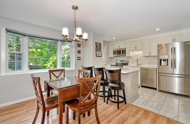 50 Lake St Unit B, Winchester, MA 01890 - dining area featuring a chandelier, light marble finish floors, and recessed lighting