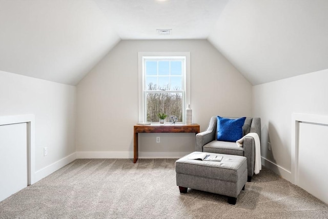 sitting room with light carpet and lofted ceiling