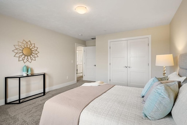 bedroom featuring a closet and light carpet