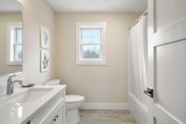 full bathroom featuring vanity, toilet, a healthy amount of sunlight, and shower / bathtub combination with curtain