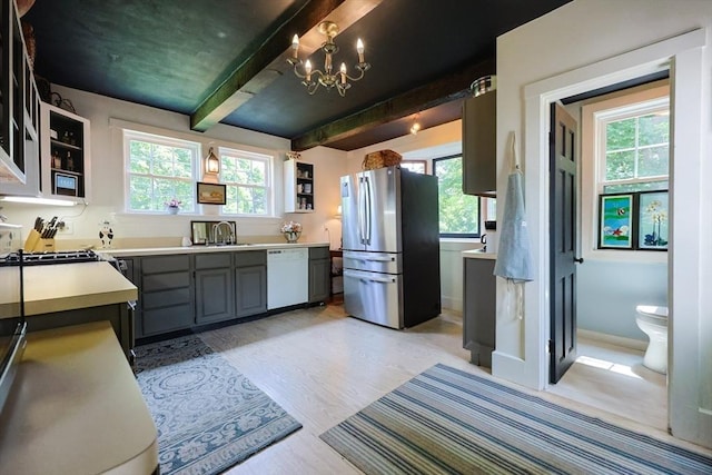 193 Main St, Medway, MA 02053 - kitchen with freestanding refrigerator, dishwasher, a chandelier, open shelves, and light countertops