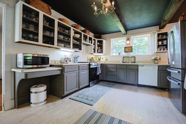 193 Main St, Medway, MA 02053 - kitchen featuring stainless steel appliances, open shelves, gray cabinets, light wood finished floors, and beam ceiling