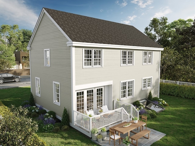 rear view of house with a yard and a patio area