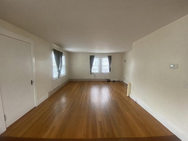 spare room featuring hardwood / wood-style floors