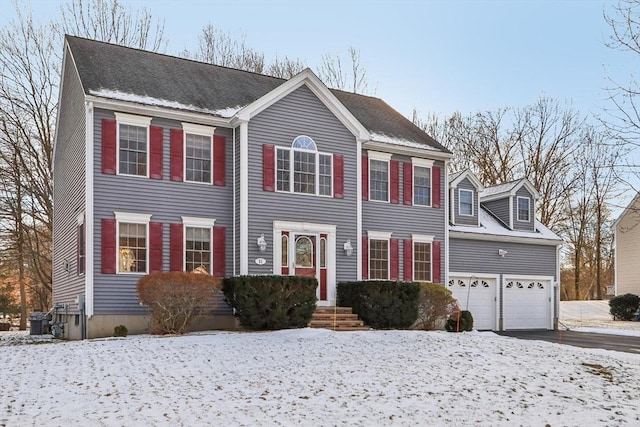 colonial-style house featuring a garage