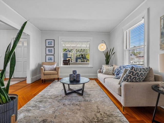 living room with baseboards and ornamental molding