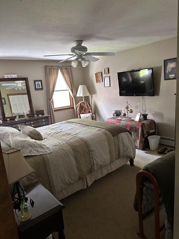 37 Teaberry Ln, Gardner, MA 01440 - bedroom with baseboard heating and a ceiling fan